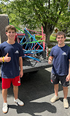 J's Junk Removal crew loading a trailer in Montgomery County, MD